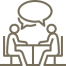 Two people engaged in conversation